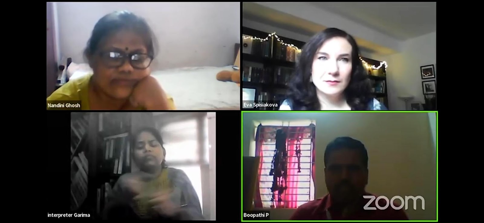 A Zoom call screenshot featuring four participants: Nandini Ghosh, Eva Spisakova, Interpreter Garima (signing), and Boopathi P, each in their respective video frames.