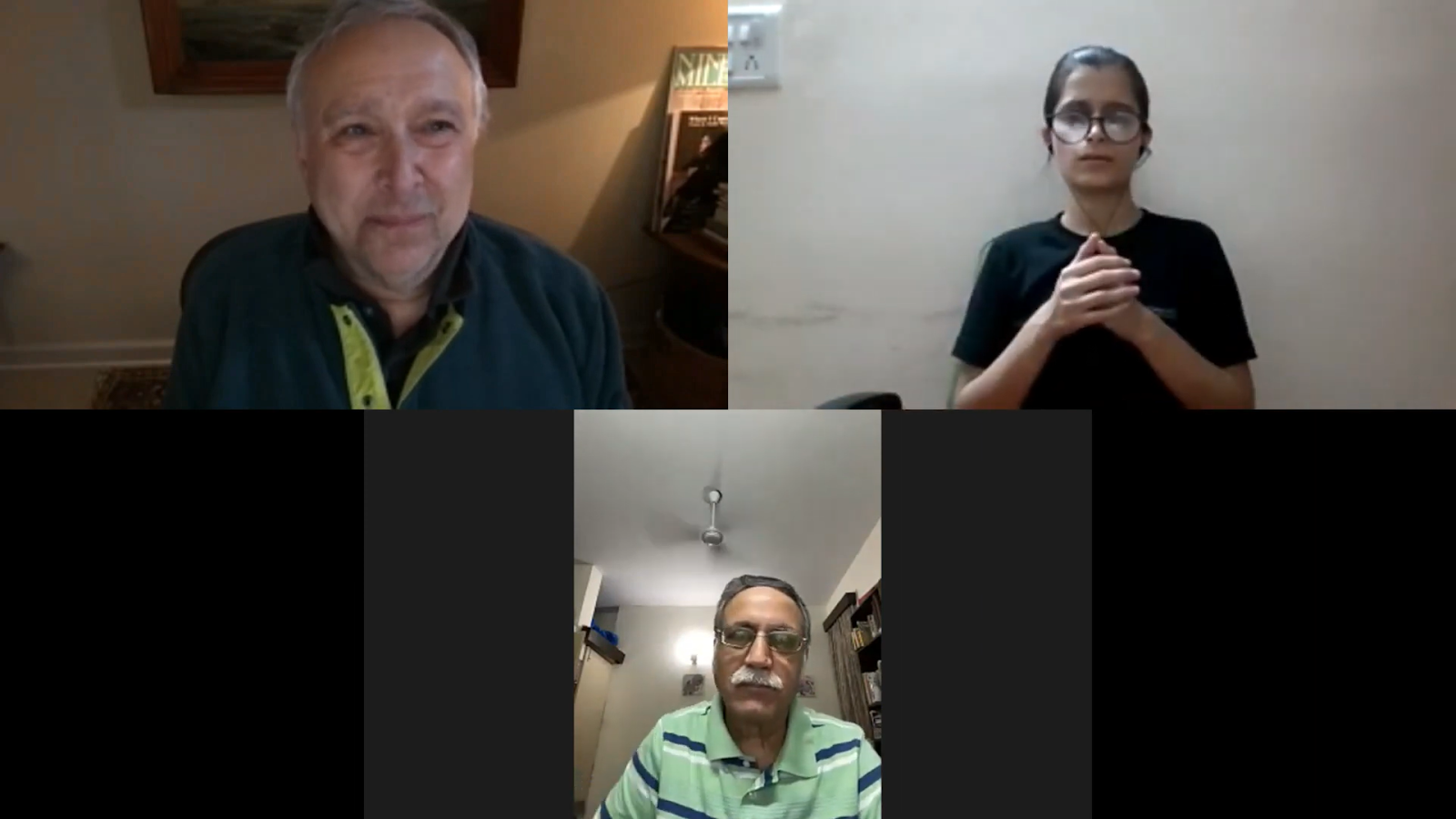 A three-person video call shows an older man with grey hair and a green shirt, a young woman with glasses and a black shirt, and another man with a mustache and striped shirt.