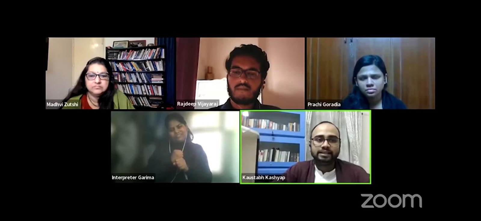 A five-person Zoom call displaying participants Madhvi Zutshi, Rajdeep Vijayaraj, Prachi Goradia, Interpreter Garima, and Kaustabh Kashyap in individual video frames against dark backgrounds with bookshelves.