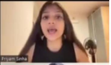 A young woman with long dark hair, labeled "Priyam Sinha," is captured in a close-up video call frame, appearing to be speaking with her mouth open.